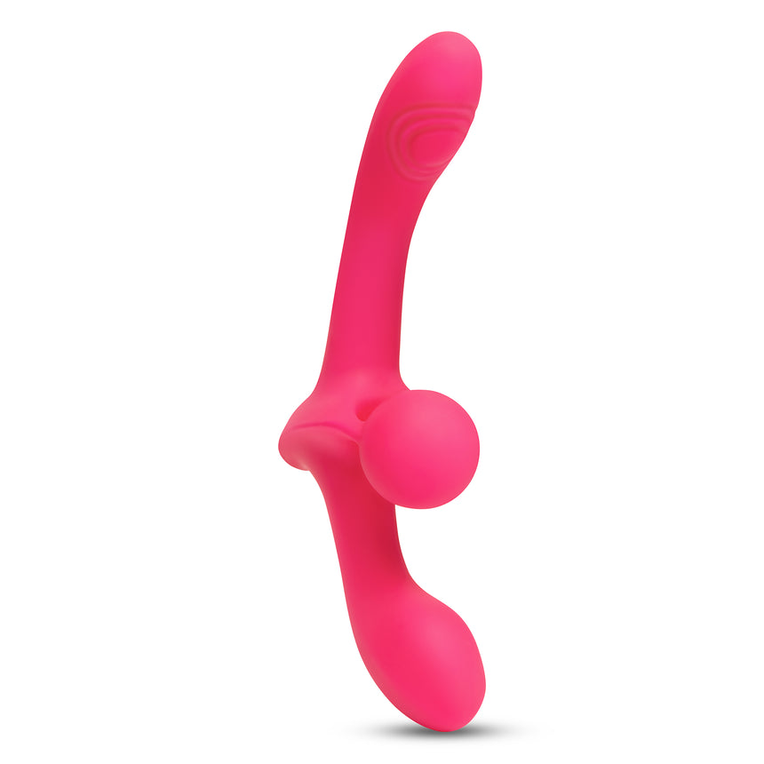 Pink silicone Double-Ended Vibrating Strapless Strap-On on a white background