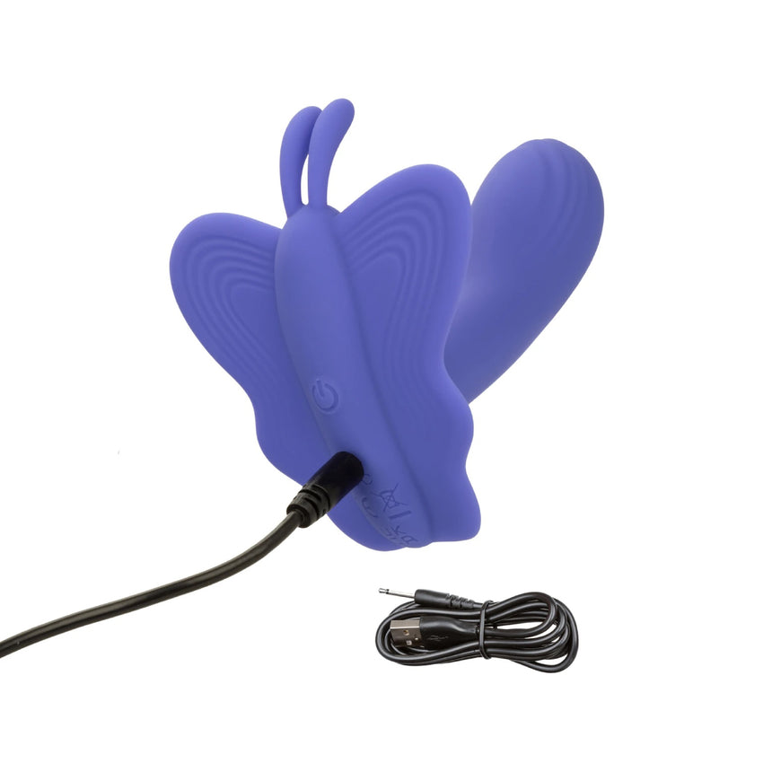 Purple Connect Venus Butterfly stimulator shown connected to its black USB charging cable.
