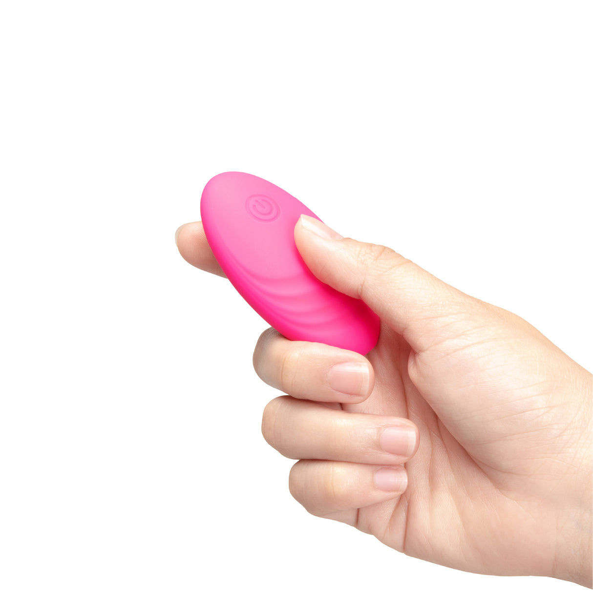 Hand holding a pink remote control on a white background