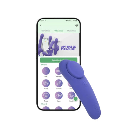 Purple CalExotics Connect Panty Teaser vibrator resting against a smartphone displaying the companion app control screen.