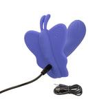 Purple Connect Venus Butterfly stimulator shown connected to its black USB charging cable.