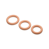 Three mocha skin tone Jock Discreet silicone cock rings shown graduated in small, medium, and large sizes.