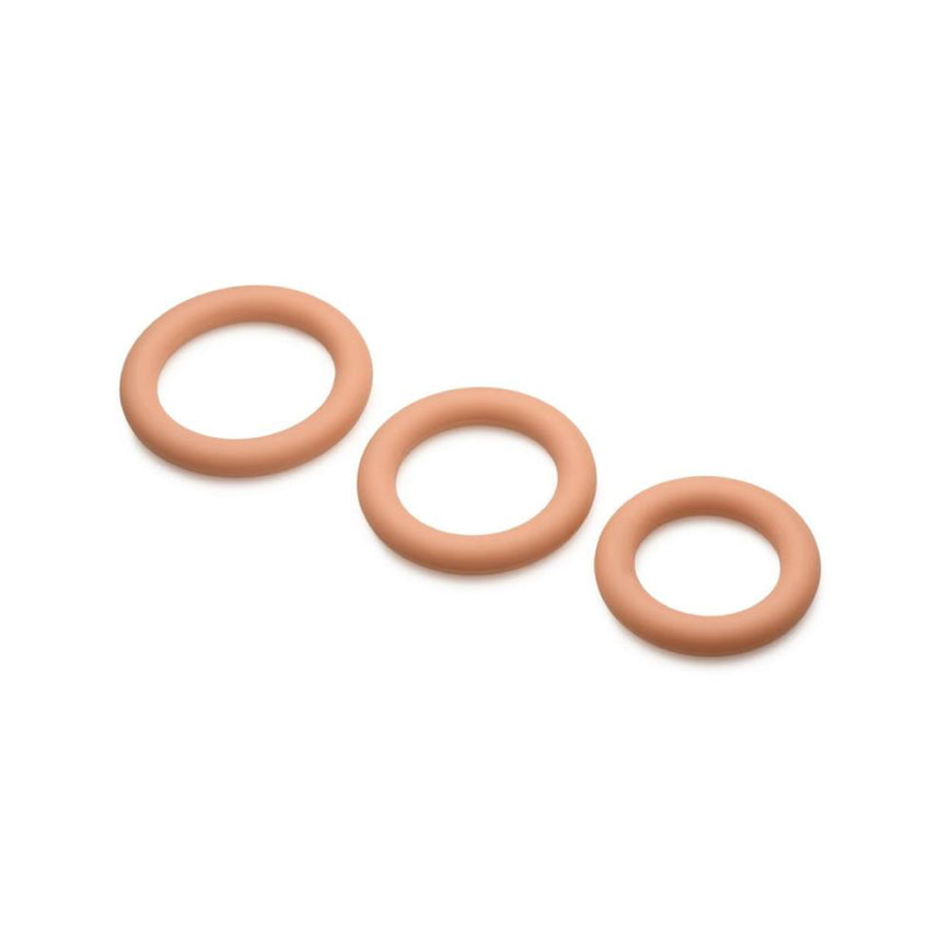 Three mocha skin tone Jock Discreet silicone cock rings shown graduated in small, medium, and large sizes.