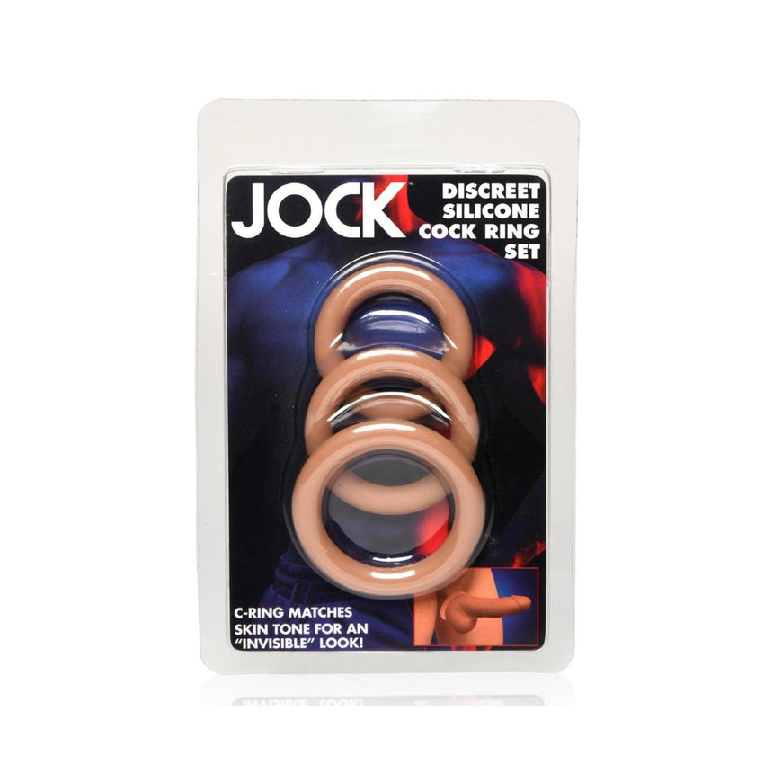 Jock Discreet Silicone Cock Ring Set in retail blister packaging, showing three skin-tone silicone rings through a clear window on a white background.