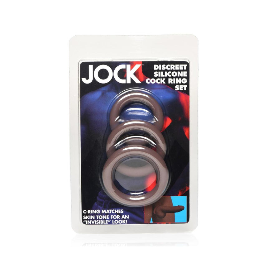 Jock Discreet Silicone Cock Ring Set in its original retail packaging, featuring three skin-tone silicone rings visible through a clear plastic blister pack.